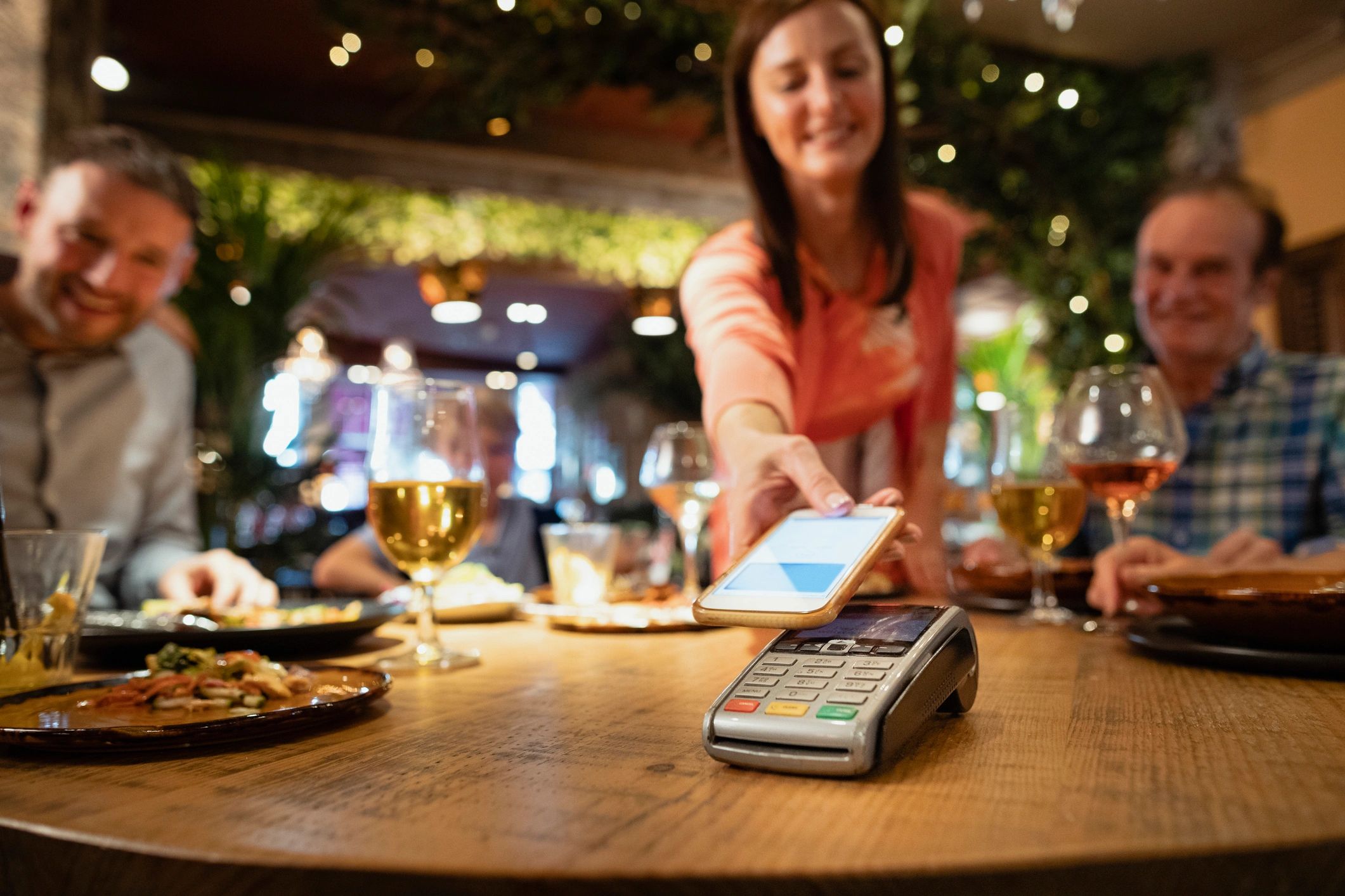 Customer making a contactless mobile payment