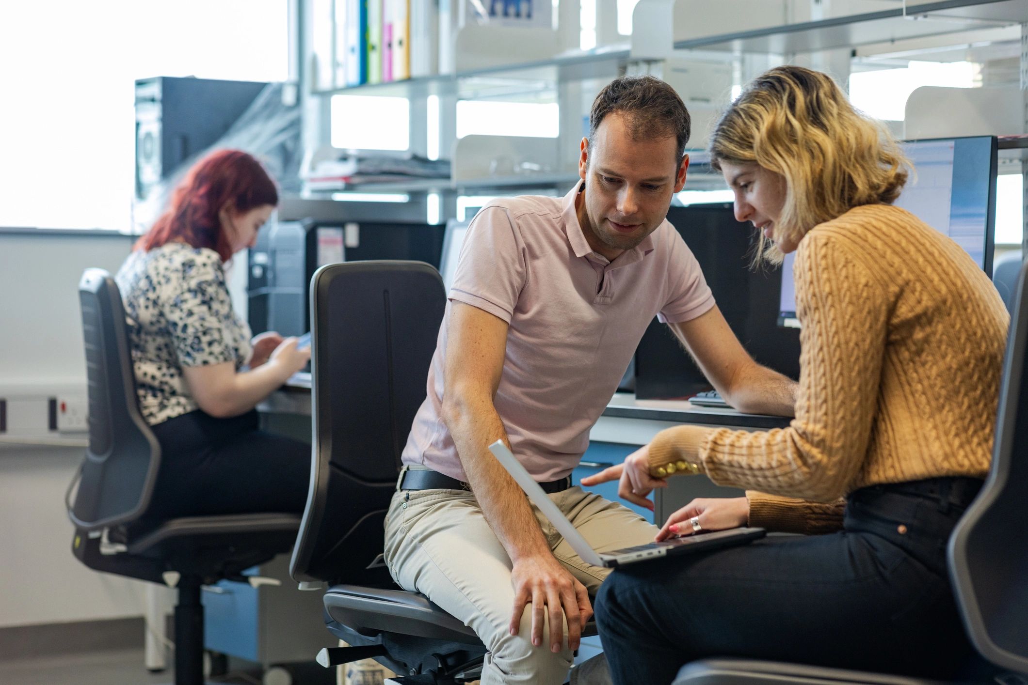 Professionals analyzing data together during a consultation